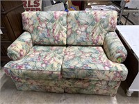 Floral Upholstery Loveseat that flips out into a