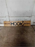 Large "OFF THE HOOK GETAWAY" hanging sign on