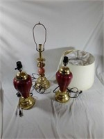 3 Gold/Rose-toned lamps. All power on (bulbs not