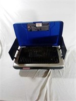Blue Coleman tabletop Grill. One footing missing.