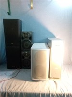 A lot that includes 4 speakers and two sub