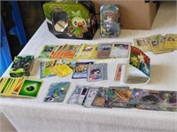 pokemon trading card collection, tins, cards, pika
