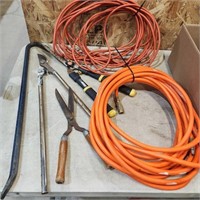 Grass snips, crowbar, air hose, ext cord