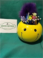 Smiley Face holder with contents 4” tall