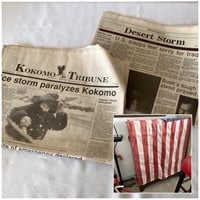 Assorted newspapers and American Flag