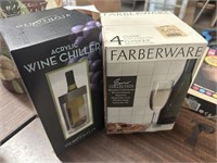 4 wineglasses and wine chiller