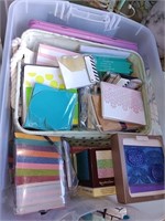 Plastic bin of card, making supplies and cards.