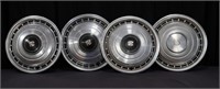 Four 1970s Cadillac Hubcaps