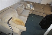 Sectional with end recliners, located in basement