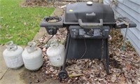 Propane grill w/3 tanks, one is fairly full