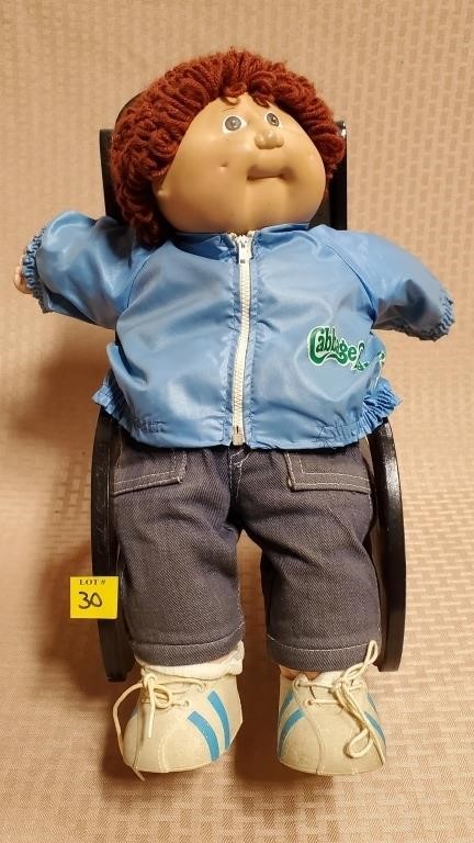 Cabbage Patch Doll on Doll Rocking Chair