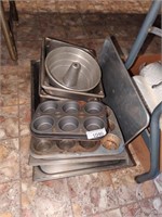 Lot of stainless steel pans, cupcake pans and