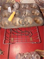 Old kitchen utensils and cupcake pan