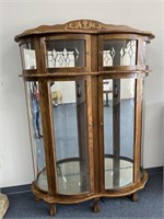 Oak curio cabinet with rounded front,  2 locking