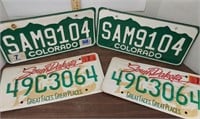 Colorado and South Dakota license plates.