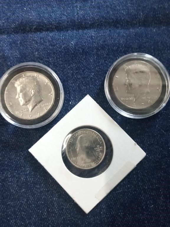 Lot includes two Kennedy half dollars one from