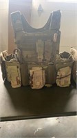 Military style ruck vest with pouches and camel