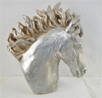 A Silver and gold painted horse's head sculpture