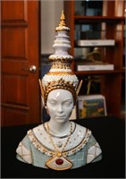 A bust of a Thailand Woman adorned with headdress