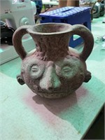 Pottery faced vase 9in.tall