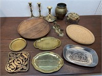 Brass trays, trivets, vase and candle sticks,