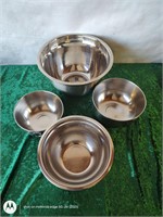 Stainless steel nesting mixing bowls.