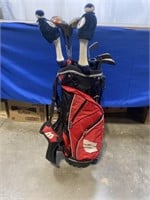 Wisconsin golf bag with assorted Woods and Wedges