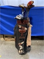 Golf bag with Cleveland wedges and WI Ducks