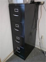 4 drawer file cabinet in office