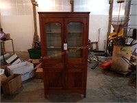 Wooden cabinet with glass