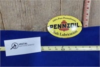 Pennzoil Badge off of Oil Container