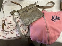 Small Nike jacket and two coach purses