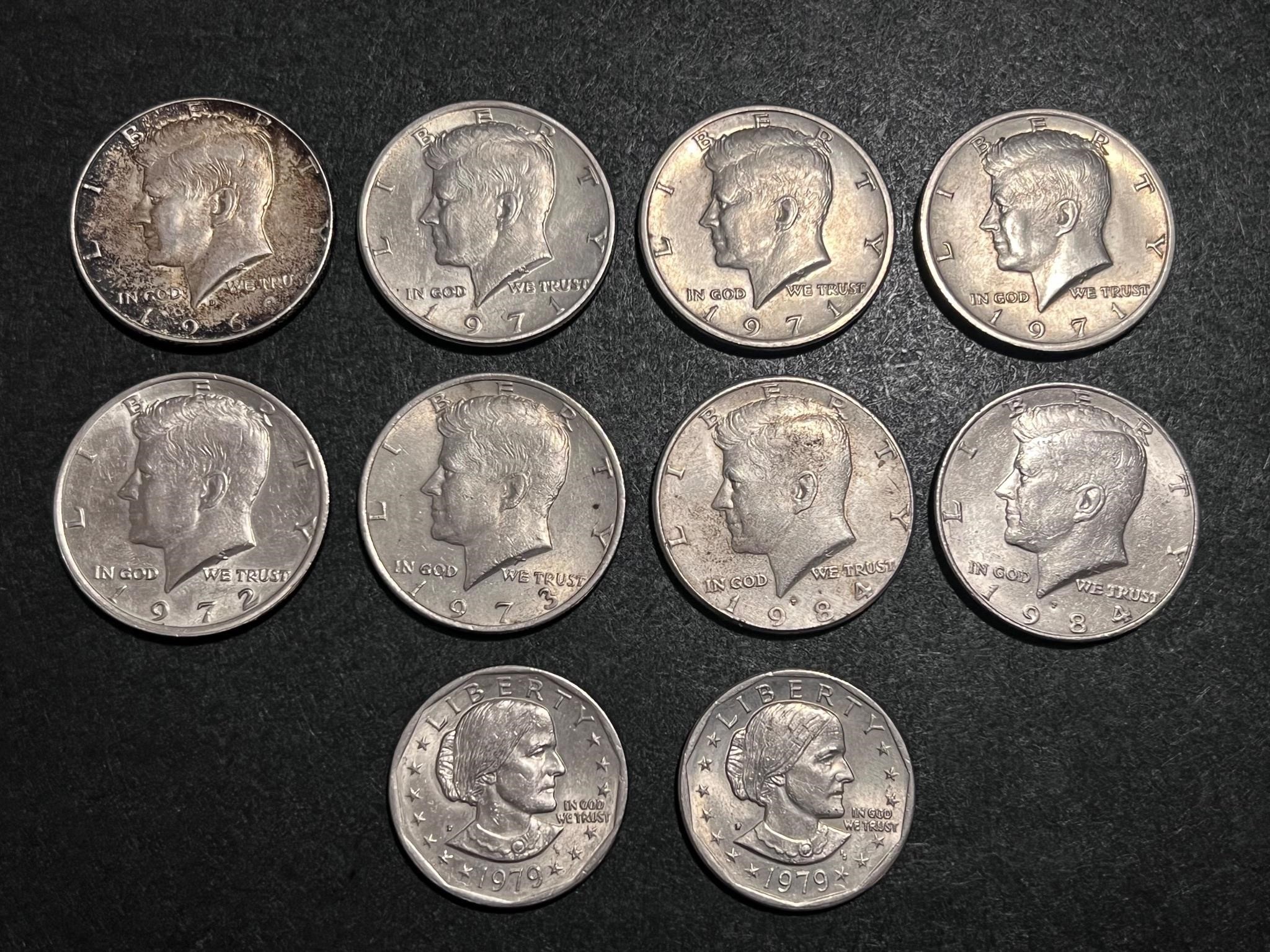 Lot of 10 coins, 8 half dollars & 2 one dollar coi