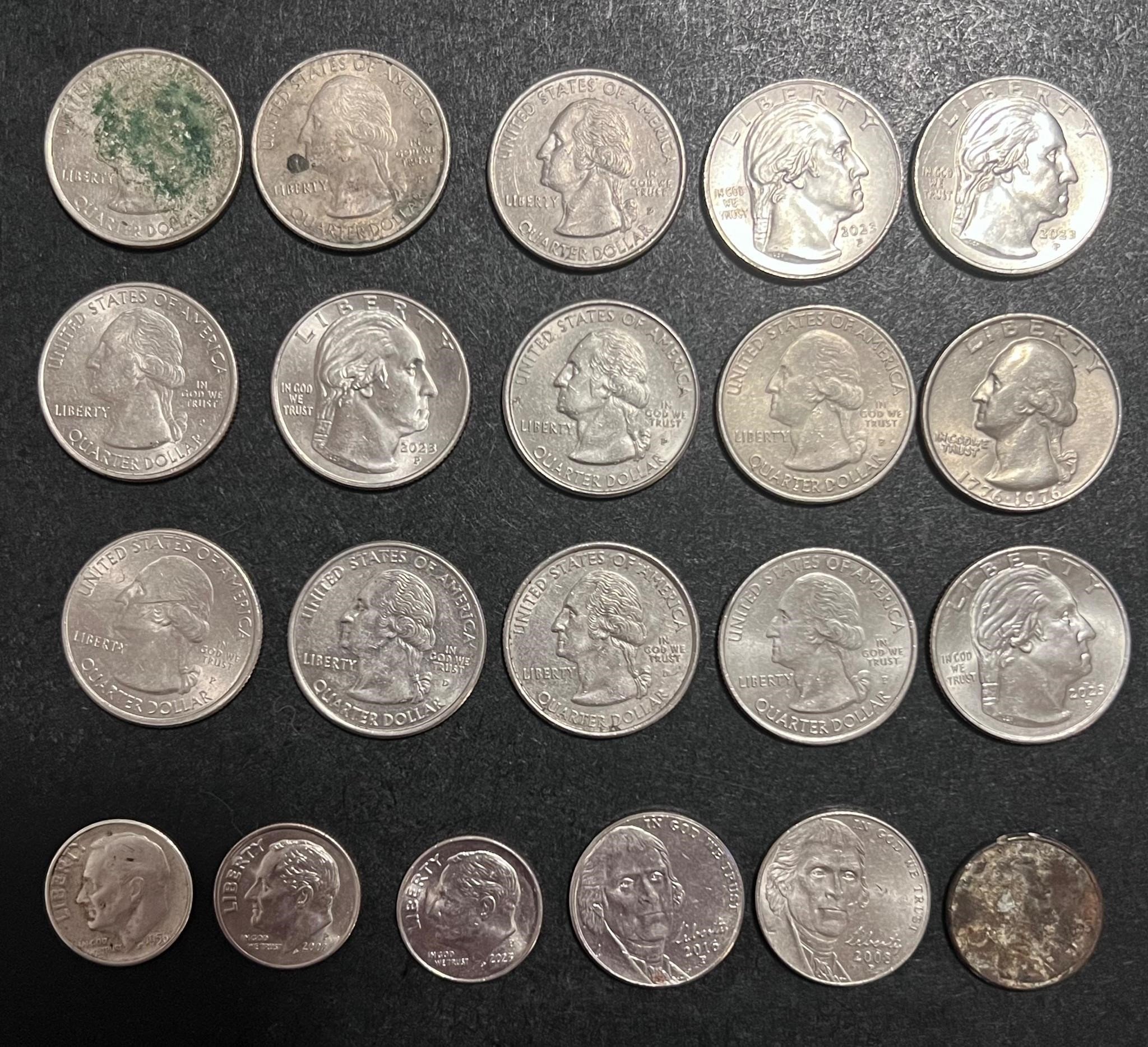 Lot of quarters, nickels, dimes, and a penny 99-23