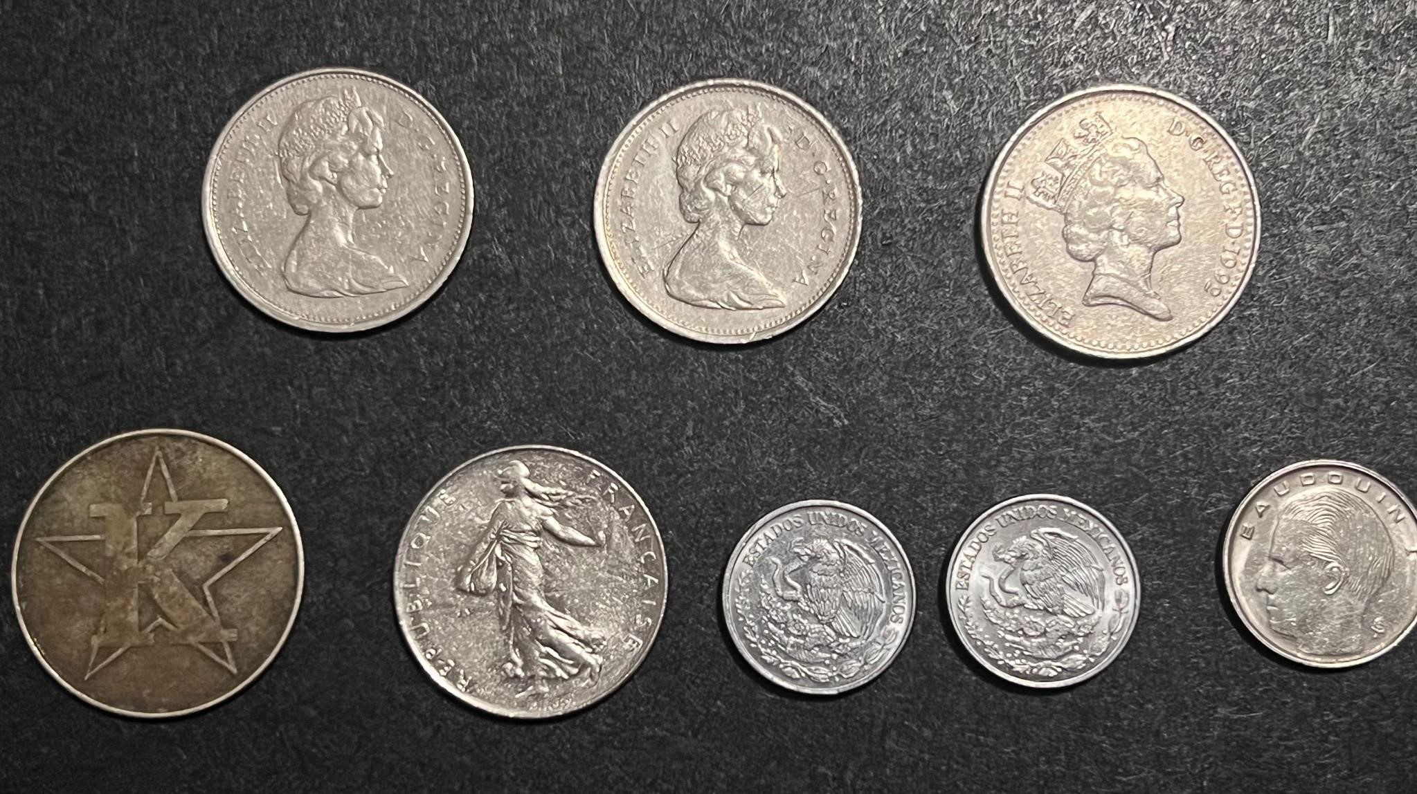 Lot of 8 foreign coins. See pics