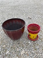 One medium plastic pot, one small clay pot