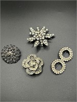 Four Silver-Toned Brooches