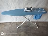 Folding metal ironing board with steam iron