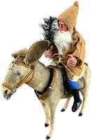 SANTA RIDING A NODDING DONKEY