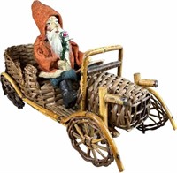 SANTA DRIVING AN OPEN WICKER CAR