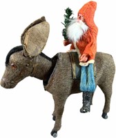 SANTA RIDING A NODDING DONKEY