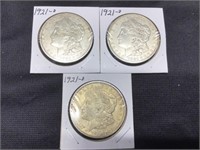 Three 1921-D Morgan Dollars