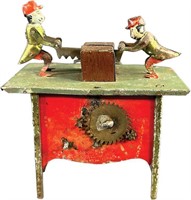 WIND-UP MONKEY SAWING ON TABLE TOY