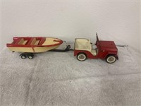 Red Tonka jeep with boat and trailer