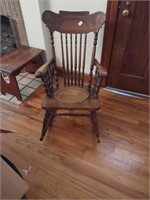 Antique oak rocking chair featuring animals