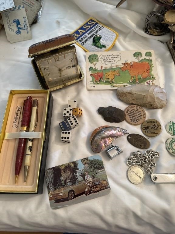 Group of items - arrowheads, tablecloth, pens,