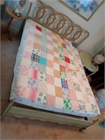 Super cute summer quilt. Displayed on a full size