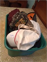 Tote of ball caps and hats