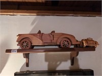 Homemade shelf, cars, and praying hand shelf