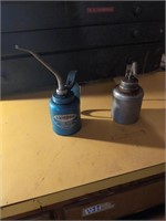 2 metal oil cans